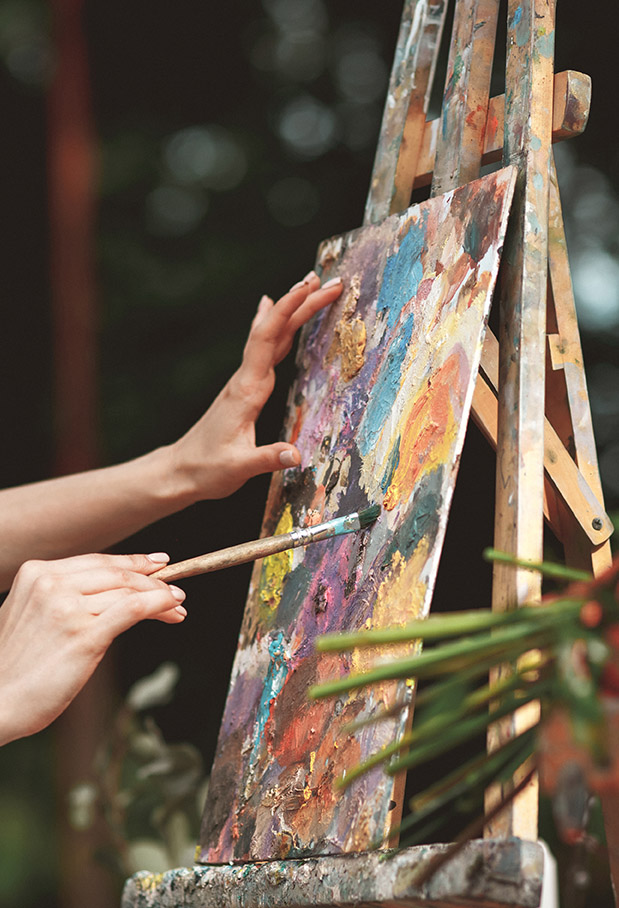 Artist's hand close-up on the background of picture